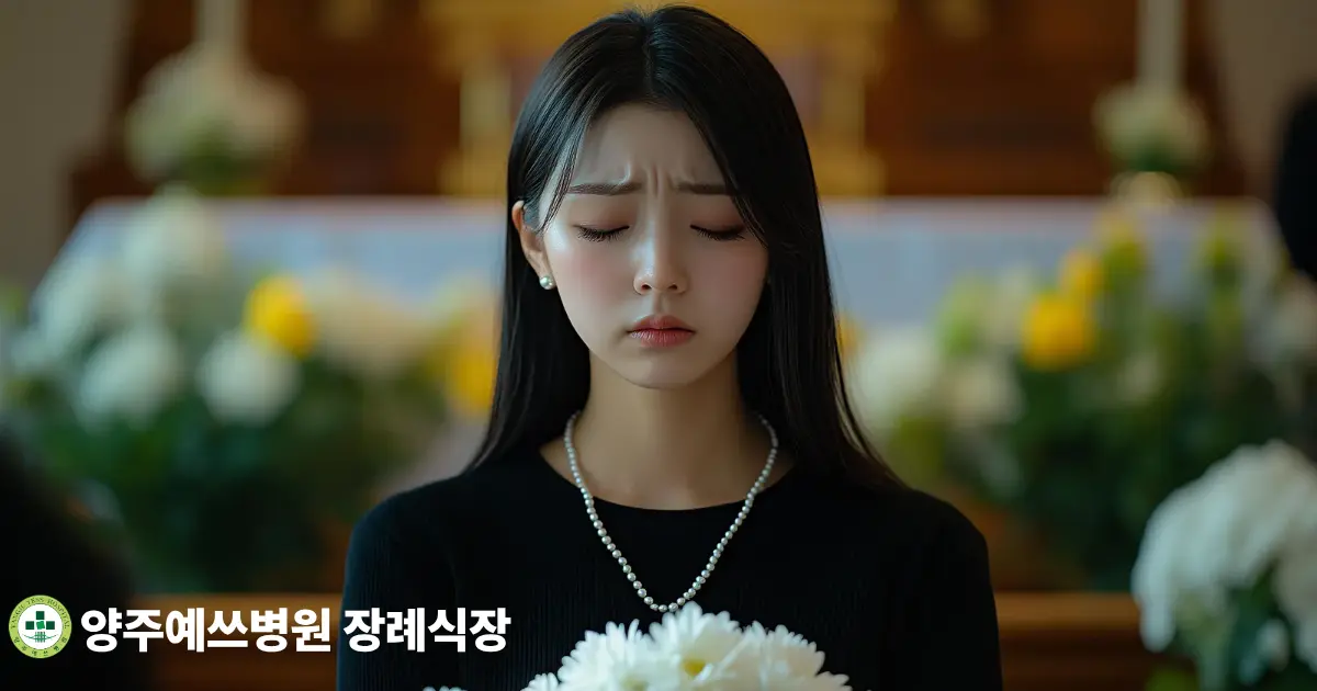 흰 국화를 들고 고인을 추모하는 가족